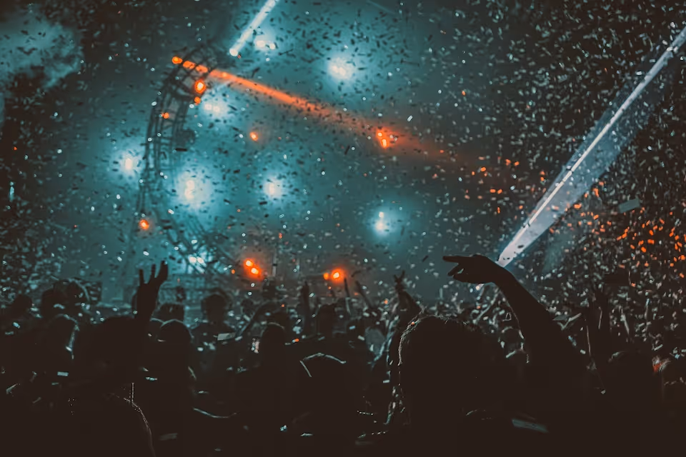 crowd partying with red stage lights