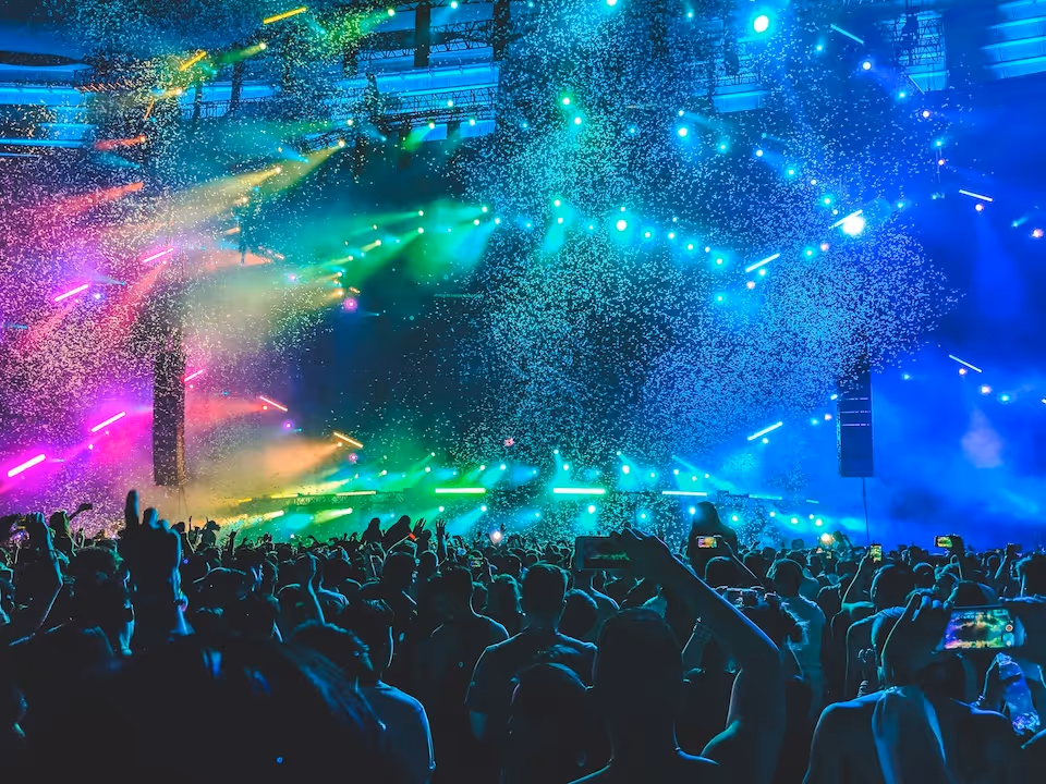 group of people standing on the field with bubbles