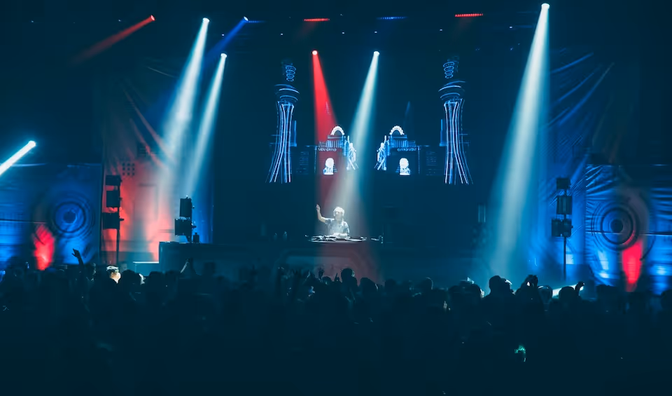 person standing in stage in front of people